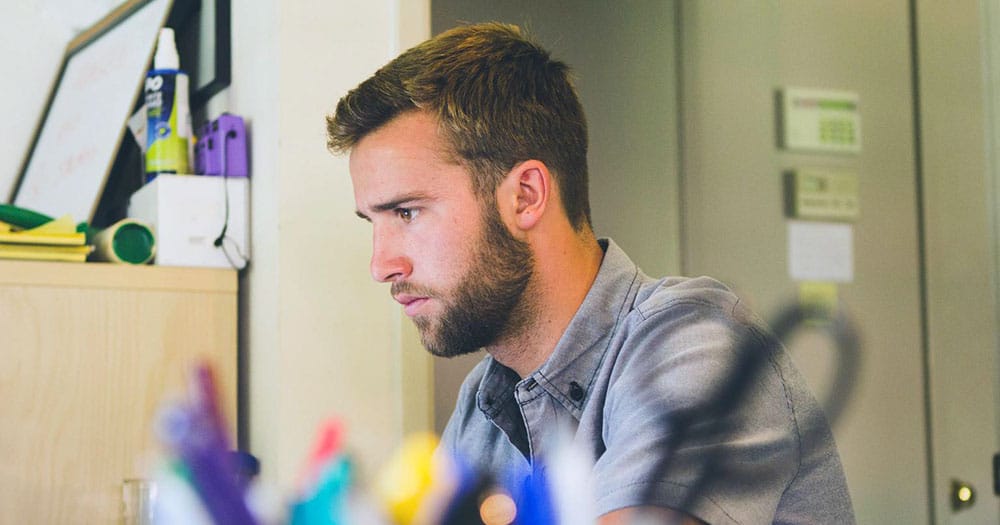 Side profile of man focusing